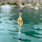 Bracciale marinaro in argento giallo, pietre multicolors semipreziose e tre ciondoli : conchiglia, cavalluccio marino e stella marina